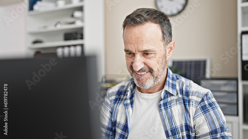 Middle age man business worker using computer working at office