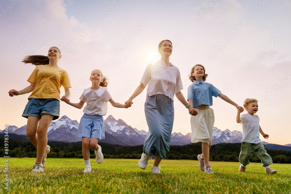 Happy family at sunset