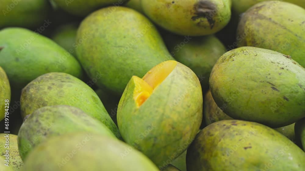 A close-up of luscious, ripe mango sliced for sampling at the roadside fruit shop A close-up of luscious, ripe mango sliced for sampling at the roadside fruit shop