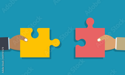 Teamwork or collaboration concept. Two hands holding jigsaw puzzle pieces to put them together as sign of partnership. Metaphor of team work. Flat design. Vector illustration.