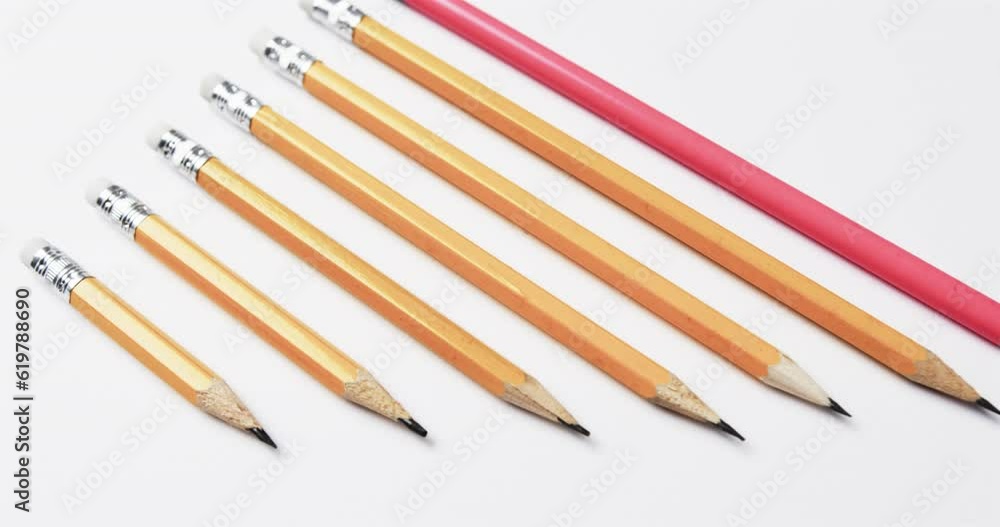 Close up of pencils arranged on white background, in slow motion Close up of pencils arranged on white background, in slow motion