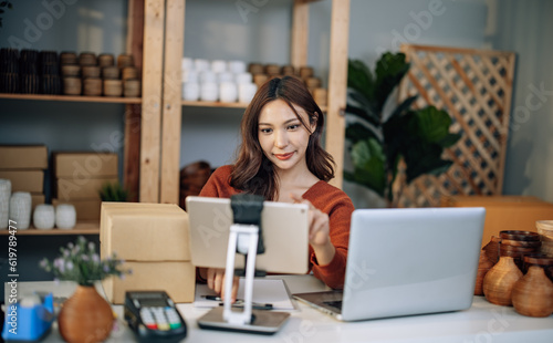 A Small business owner is live streaming to sell vases online. Manage e-commerce inventory, process orders, build trust with customers through reliable delivery to ensure a good shopping experience.