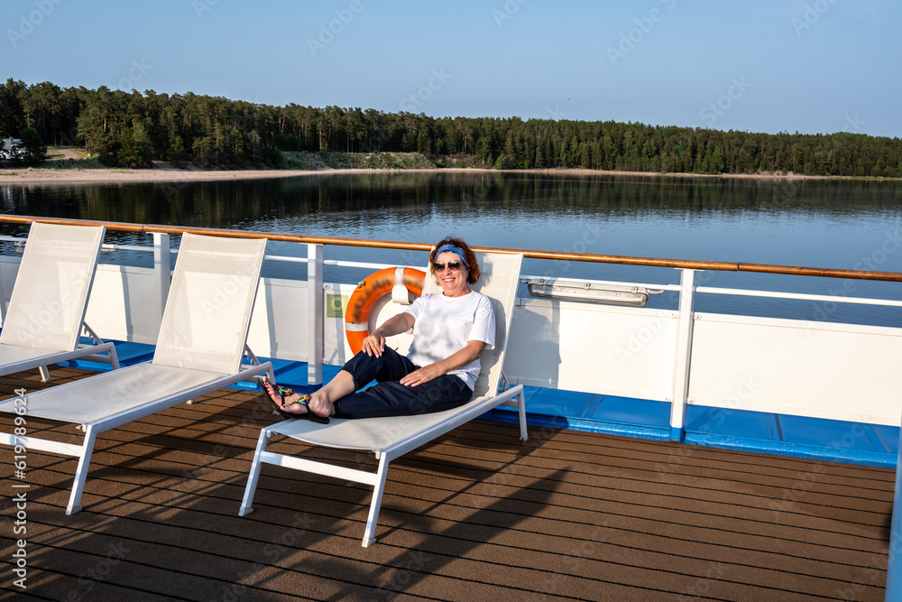 woman on a cruise ship on a summer evening