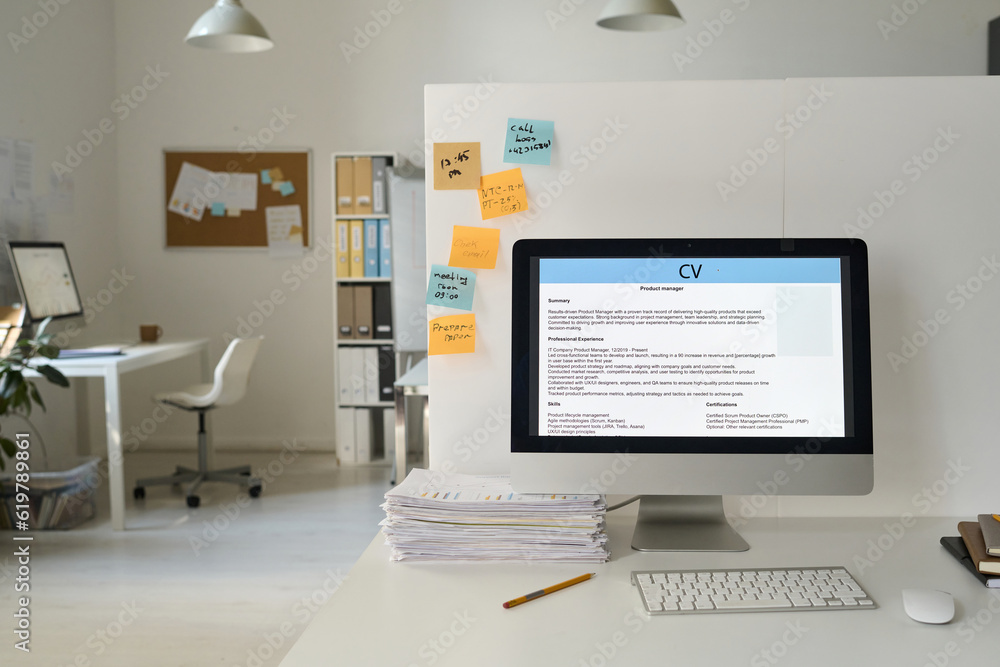 Workplace of business person with computer with online resume on monitor in modern office Workplace of business person with computer with online resume on monitor in modern office