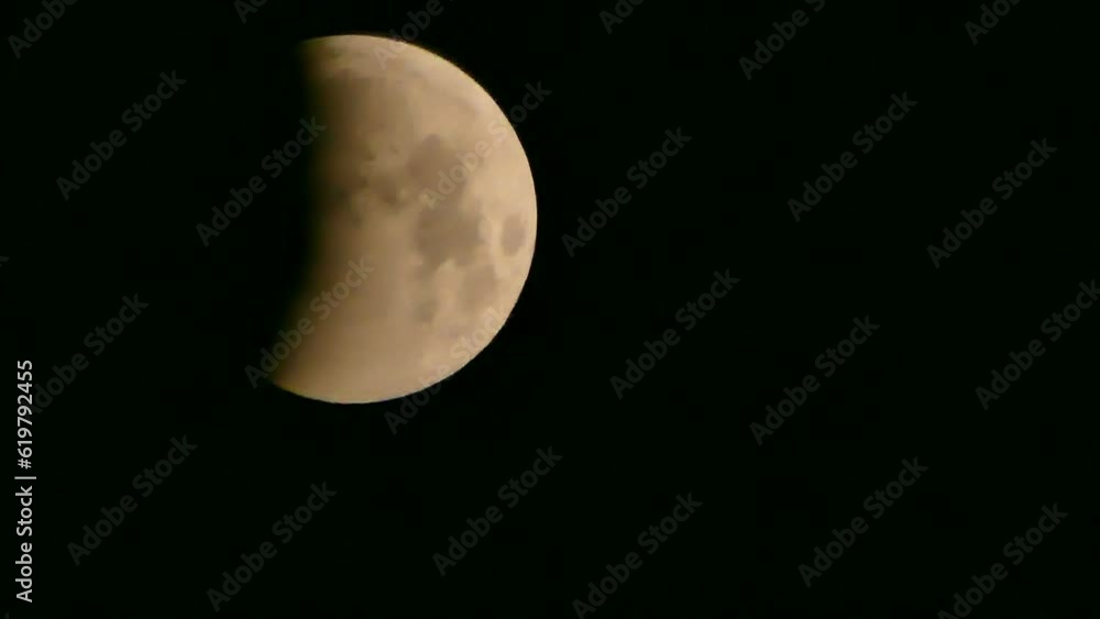 Total lunar eclipse, black night sky, moving thin clouds. Moon and shadow of planet Earth observed at night in January 2019 - real time. Topics: astronomical observations, space, astronomy, weather. Total lunar eclipse, black night sky, moving thin clouds. Moon and shadow of planet Earth observed at night in January 2019 - real time. Topics: astronomical observations, space, astronomy, weather.