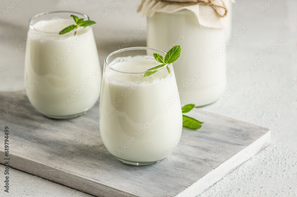 Glass cup of Turkish traditional drink ayran , kefir or buttermilk made from yogurt, healthy food Glass cup of Turkish traditional drink ayran , kefir or buttermilk made from yogurt, healthy food