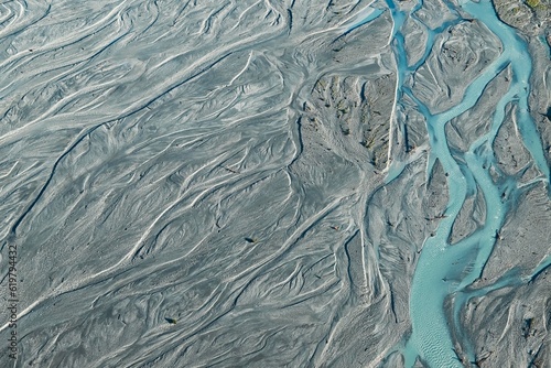 Fotografie An aerial view of Glacier water from Mount Cook flowing through the Waiho River in Franz Josef, Southland, New Zealand