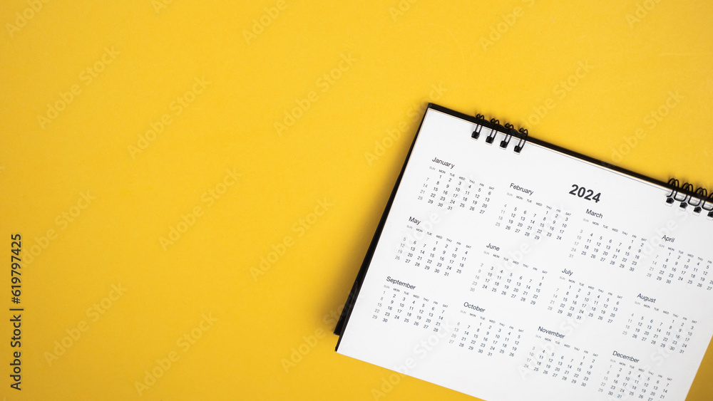 Calendar year 2024 schedule on yellow background.
2024 calendar planning appointment meeting concept. 
copy space.
top view.
 - obrazy, fototapety, plakaty 