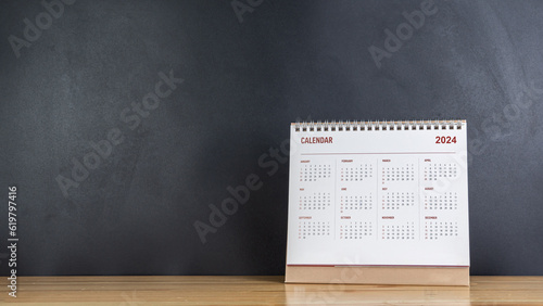 Calendar year 2024 schedule on wood table blackboard background.
2024 calendar planning appointment meeting concept. copy space.