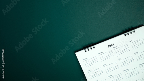 Calendar year 2024 schedule on green dark background.
2024 calendar planning appointment meeting concept. 
copy space.
top view.