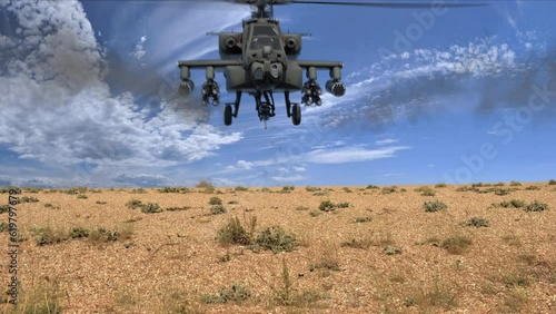 Attack helicopter fires machine gun and rockets at camera in the desert, good use for Middle Eastern War e.g. Afghanistan. Helicopter fires missiles  photo