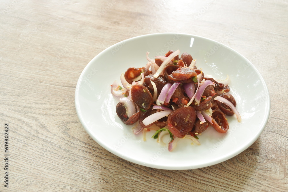 spicy and sour Chinese pork sauce with shallot salad on plate spicy and sour Chinese pork sauce with shallot salad on plate
