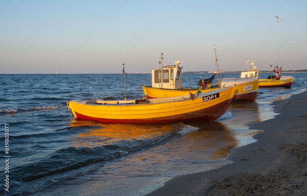 Fishing boats on the beach of Baltic Sea in Poland.