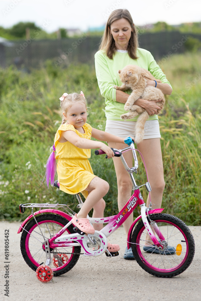 Girl learning to ride a bike Girl learning to ride a bike