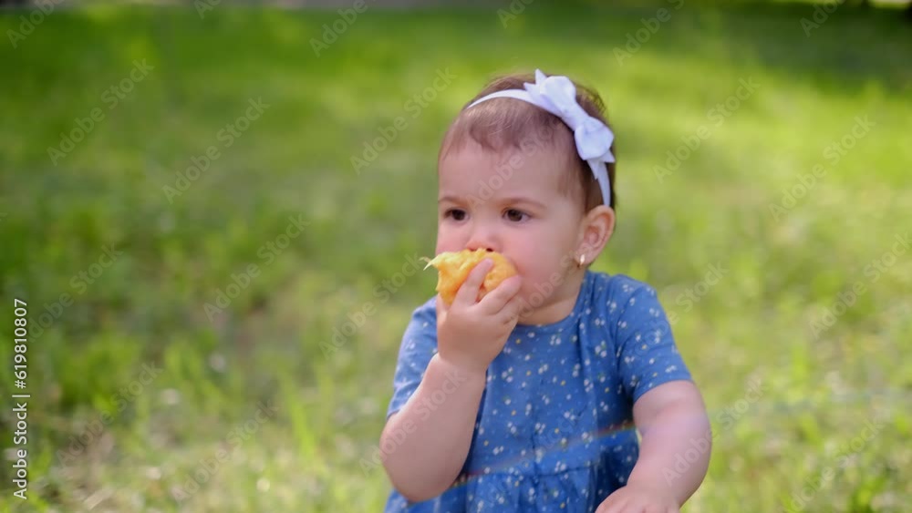little cute girl eats palsin, orange juice flows down her hands, vitamin consumption, orange natural juice, vitamins for children little cute girl eats palsin, orange juice flows down her hands, vitamin consumption, orange natural juice, vitamins for children