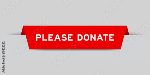 Red color inserted label with word please donate on gray background