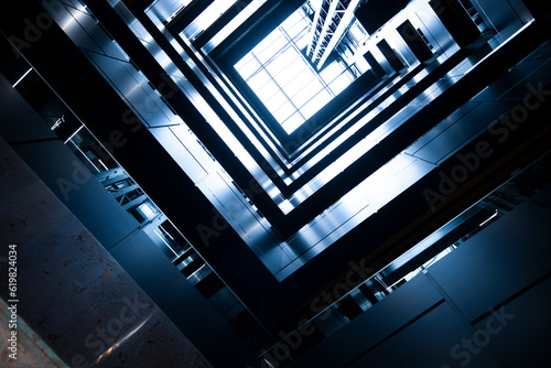 Obraz na płótnie Modern urban architecture. Inside the office center. Upward view perspective. w salonie
