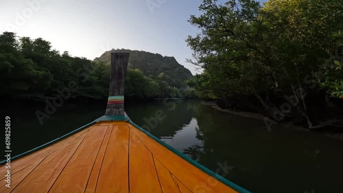 Travel by long-tail boat to islands and bays in Thailand photo