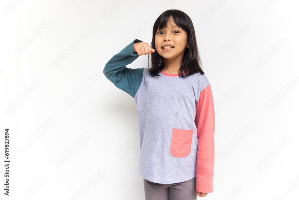 A cute confident girl raised her hands to show tooth brush gesture A cute confident girl raised her hands to show tooth brush gesture