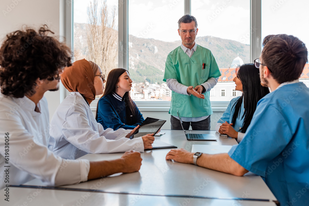 Medical team interacting at a meeting in conference room. Medical team interacting at a meeting in conference room.