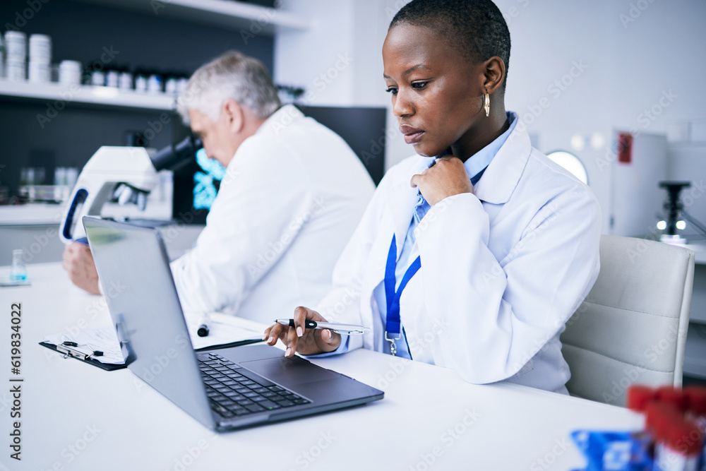 Laptop, science and woman in a laboratory for research, internet or medical results. Serious person and a man scientist or doctor team with tech for scientific innovation, planning or data report Laptop, science and woman in a laboratory for research, internet or medical results. Serious person and a man scientist or doctor team with tech for scientific innovation, planning or data report