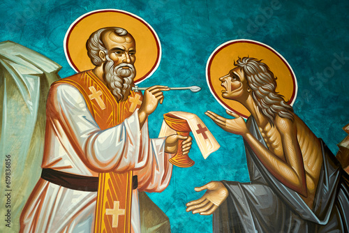 Obraz na płótnie Depiction of a priest giving medicine to the poor