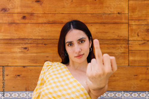 Fotografie Rude woman showing the index finger to the camera