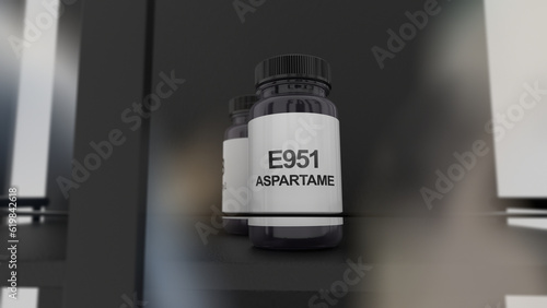 A little bottle of E951 aspartame, artificial non-saccharide sweetener food additive on a on a chemistry shelf. photo