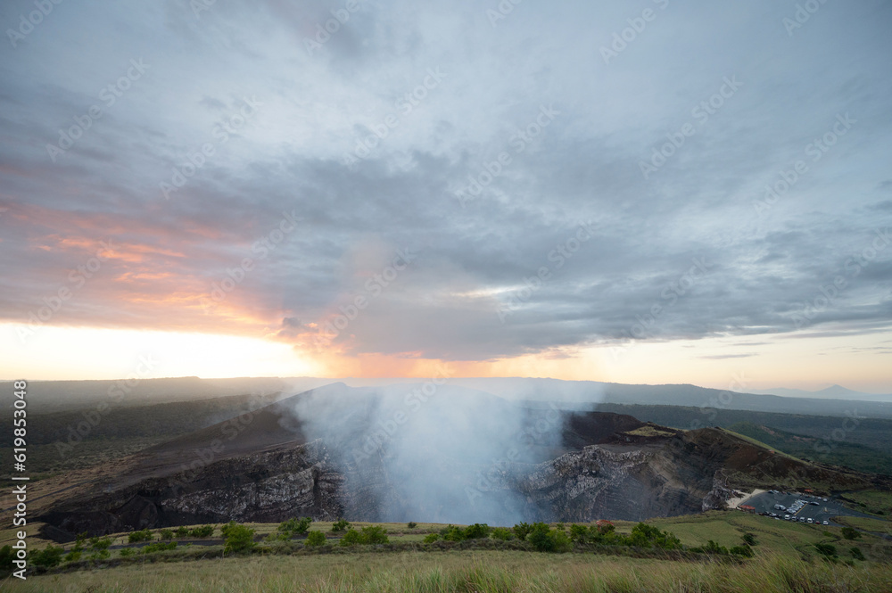 Gas emission go up from volcano crater Gas emission go up from volcano crater