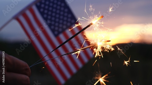 Happy Independence Day July 4th, Labor Day. Hand holding sparklers fireworks celebration fourth of July, 4th of July with America flag background. Concept Holiday, Freedom, Memorial, Veterans Day