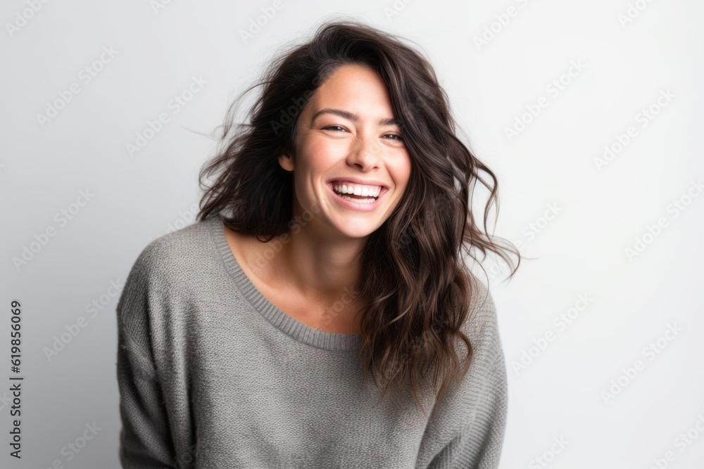 Portrait of a happy woman laughing and looking at camera isolated on a white background Portrait of a happy woman laughing and looking at camera isolated on a white background