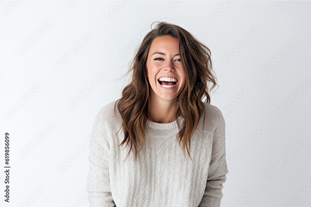 Portrait of a happy young woman laughing and looking at camera over white background Portrait of a happy young woman laughing and looking at camera over white background