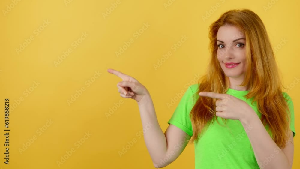Woman and pointing at mockup workspace for advert, marketing, promotion or text. Fashionable model happy smiling showing mock up for advertisement, news deal of offer in studio on yellow background Woman and pointing at mockup workspace for advert, marketing, promotion or text. Fashionable model happy smiling showing mock up for advertisement, news deal of offer in studio on yellow background
