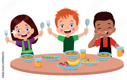 Boy and girls eating at the dining table