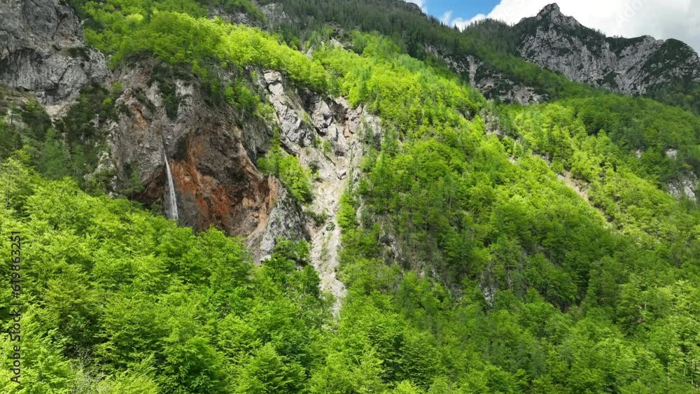 Rinka Falls in the Logar Valley (Logarska dolina) in the Kamnik Savinja Alps in Slovenia during a beautiful springtime day. Rinka Falls in the Logar Valley (Logarska dolina) in the Kamnik Savinja Alps in Slovenia during a beautiful springtime day.