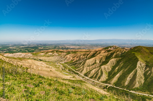 Old road in a mountain gorge. Clay mountain hills.