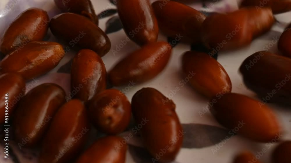 Date palm fruits. Its other names
Phoenix dactylifera. It is a flowering plant species in the palm family, Arecaceae, cultivated for its edible sweet fruit called dates. Slow motion video. Date palm fruits. Its other names
Phoenix dactylifera. It is a flowering plant species in the palm family, Arecaceae, cultivated for its edible sweet fruit called dates. Slow motion video.
