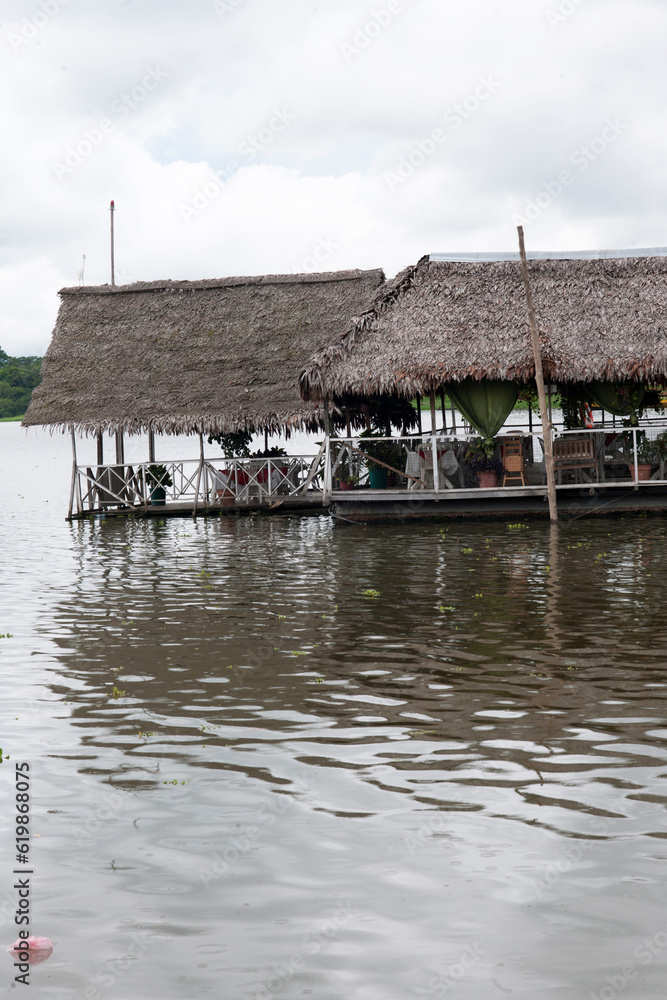Fototapeta premium pucallpa peru, yarinococha lagoon tourist place with boats and restaurant on the river coast
