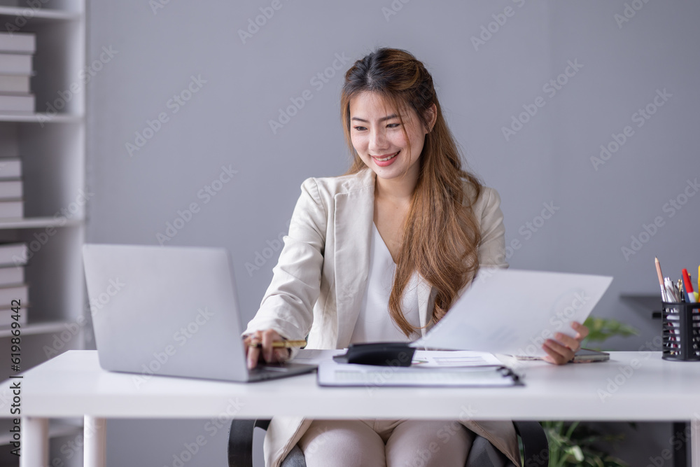 Financial Business asian women analyze the graph of the company's performance to create profits and growth, Market research reports and income statistics, Financial and Accounting concept. Financial Business asian women analyze the graph of the company's performance to create profits and growth, Market research reports and income statistics, Financial and Accounting concept.