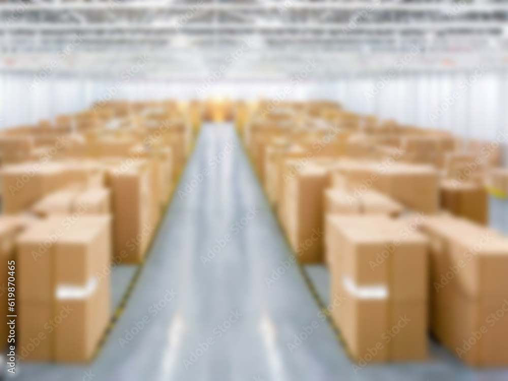 Blurred A warehouse where the goods are packed in a large number of brown cardboard boxes. Blurred A warehouse where the goods are packed in a large number of brown cardboard boxes.
