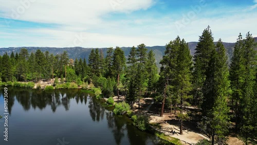 An Aerial Drone UAV View of Jenk's Lake, San Gorgonio National Forest, in the San Bernardino Mountains, Looking at the beautiful lake full after Winter Rains with People Enjoying the Water photo