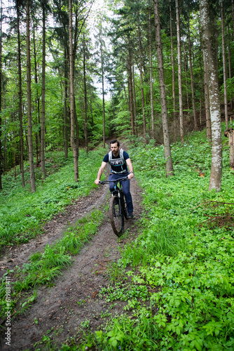 man on a mountain bike in the forest