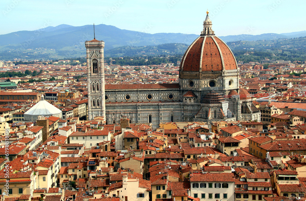 Panoramic view of the historic part of the city of Florence (Italy) with the Cathedral Cattedrale di Santa Maria del Fiore and Battistero di San Giovanni against the background of the mountains