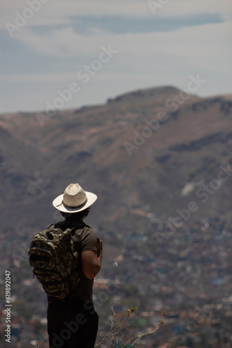 tourist traveling in Guanajuato, Mexico, contemplating the panoramic view