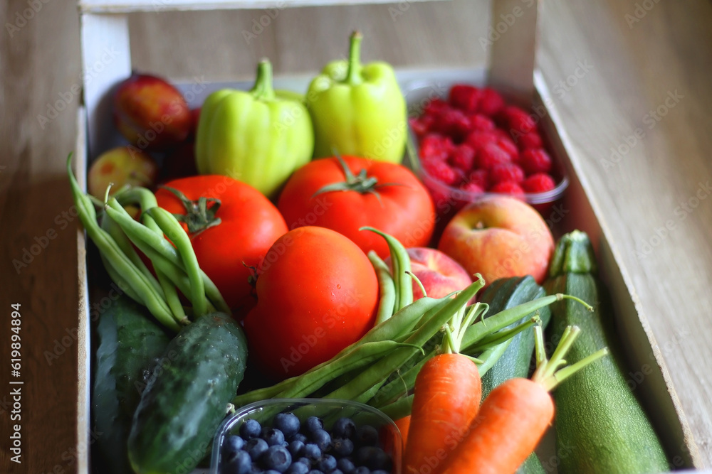 Wooden crate full of healthy seasonal fruit and vegetable. Selective focus, wooden background. Wooden crate full of healthy seasonal fruit and vegetable. Selective focus, wooden background.