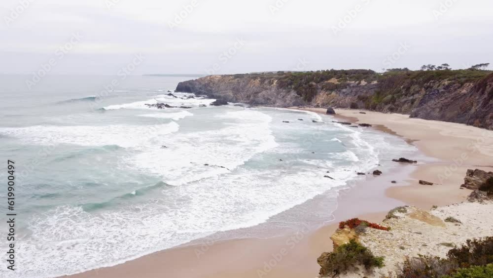 Portugal's west coast with sandy beaches and a clear Atlantic Ocean with soft light warming the sand. Algarve Region. Holidays on the beach. 4k video Portugal's west coast with sandy beaches and a clear Atlantic Ocean with soft light warming the sand. Algarve Region. Holidays on the beach. 4k video