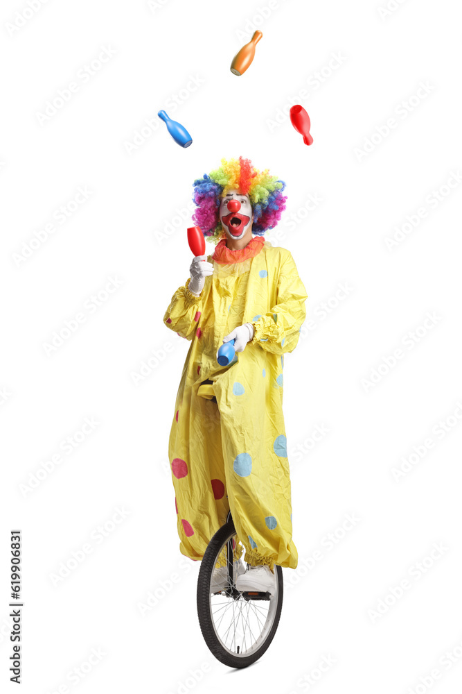 Clown on a unicycle juggling Clown on a unicycle juggling
