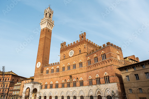 The Palazzo Pubblico in Piazza del Campo, the central square of Siena, Tuscany, Italy.