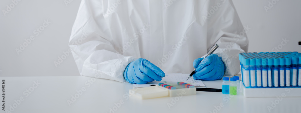 Hand of doctor or research scientist taking a test tube to check data in laboratory biotechnology specialist Ambitious new generation Works with advanced devices Hand of doctor or research scientist taking a test tube to check data in laboratory biotechnology specialist Ambitious new generation Works with advanced devices