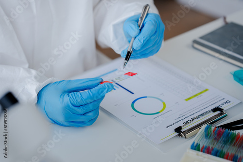 Hand of doctor or research scientist taking a test tube to check data in laboratory biotechnology specialist Ambitious new generation Works with advanced devices
